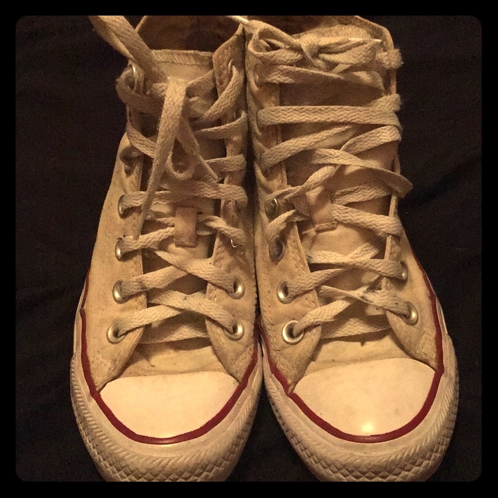 Worn White high top converse